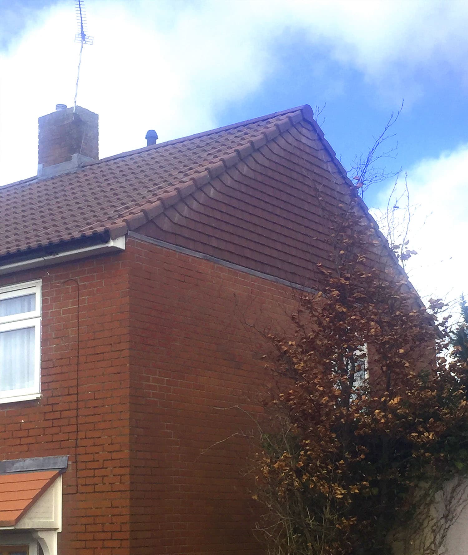 New roof tiles and guttering on a semi-detached house